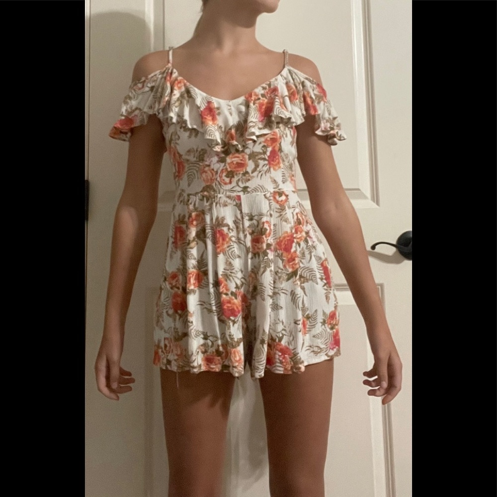 Floral print romper with spaghetti strap and off the shoulder flowy